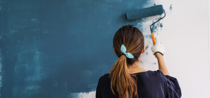 why quality paint matters women painting blue