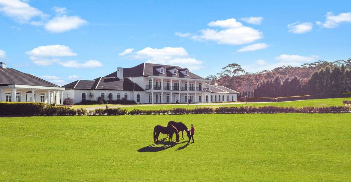 country estate home with horses on acreage