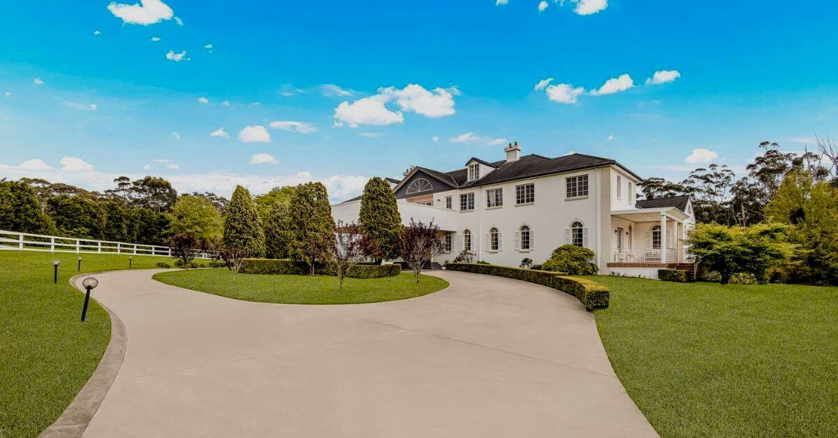 dural mansion with grand circular driveway