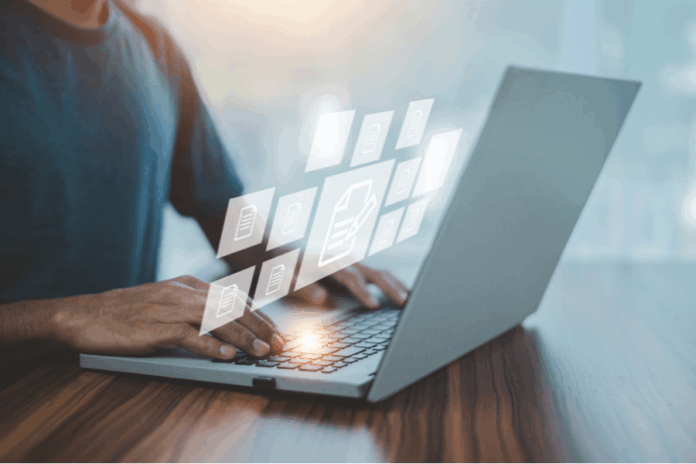 Man using laptop to look at documents