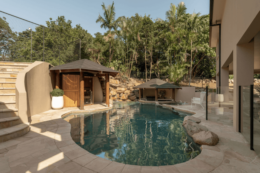 Pale tiling and patios around reflective pool water